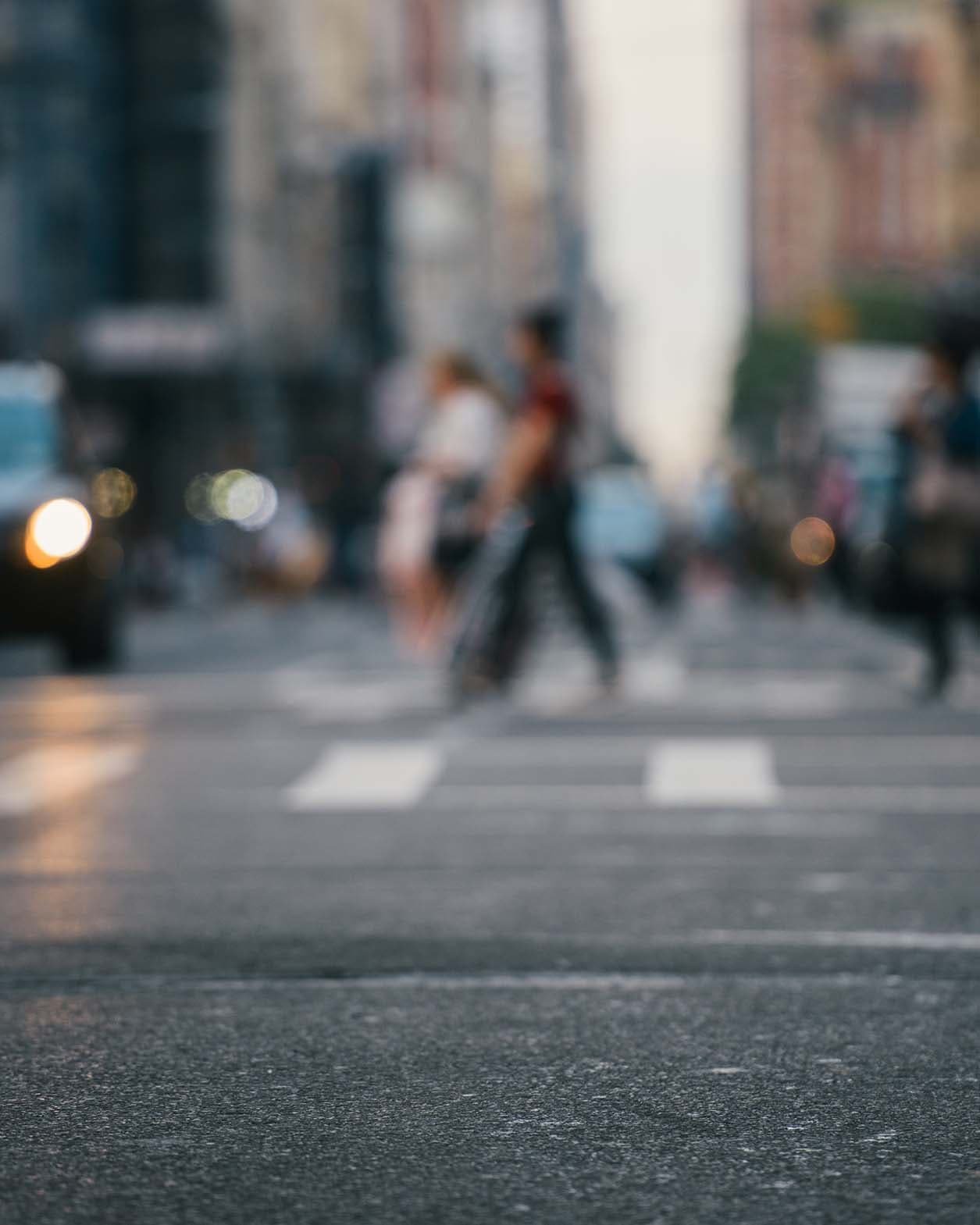 People walking across a crosswalk